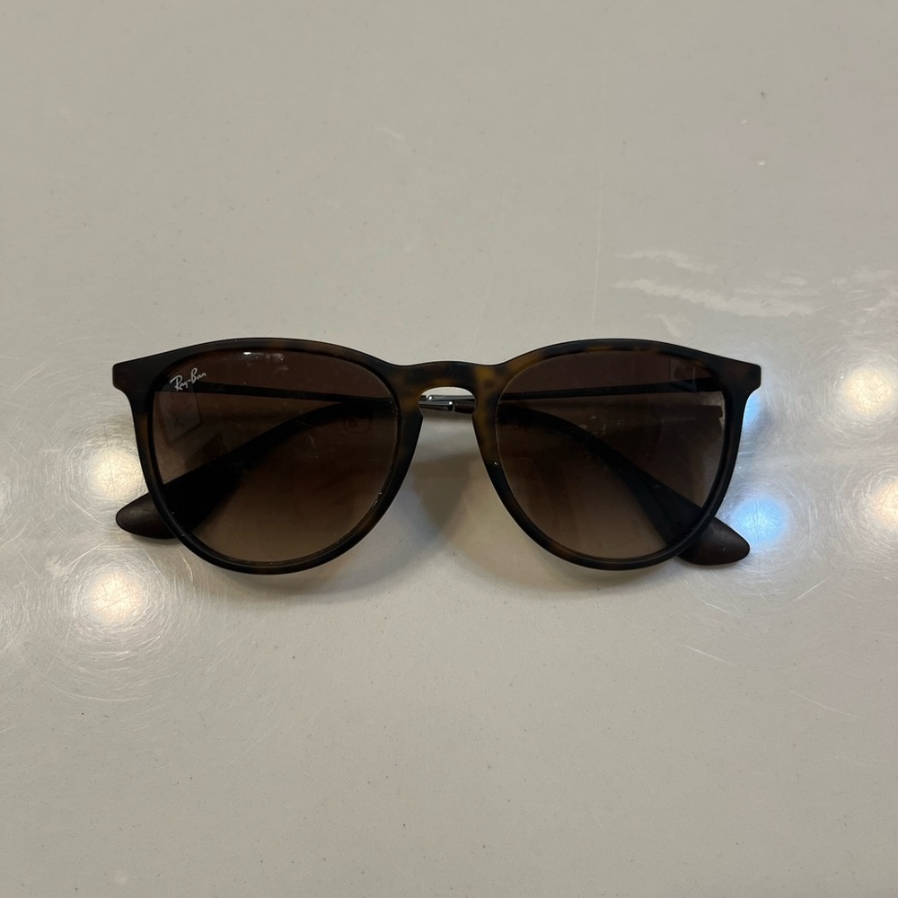 Rayban sunglasses. Worn a lot, some scuffing in the lenses.